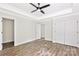 This primary bedroom features a tray ceiling, a ceiling fan, and access to the en suite at 914 Saluda St, Rock Hill, SC 29730