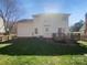 Spacious backyard with a wood deck, privacy fence, and mature landscaping, perfect for outdoor enjoyment at 9144 Cameron Wood Dr, Charlotte, NC 28210