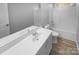 Well-lit bathroom features a single sink vanity, toilet, tub, and shower combination at 9144 Cameron Wood Dr, Charlotte, NC 28210