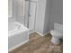 Bathroom featuring glass shower and a white toilet at 9144 Cameron Wood Dr, Charlotte, NC 28210