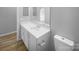 Bathroom featuring single vanity and a white toilet at 9144 Cameron Wood Dr, Charlotte, NC 28210