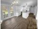Spacious kitchen and dining area featuring modern appliances, white cabinets, and backyard access at 9144 Cameron Wood Dr, Charlotte, NC 28210