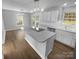 Modern kitchen with stainless steel appliances and a large island, perfect for entertaining at 9144 Cameron Wood Dr, Charlotte, NC 28210