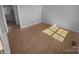 Well lit living room featuring hardwood floors at 9144 Cameron Wood Dr, Charlotte, NC 28210