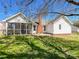 Back exterior with screened porch and brick chimney at 1025 Ridgefield Cir, Indian Trail, NC 28079
