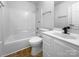 Clean and bright bathroom with modern fixtures, white cabinets and ample lighting at 1025 Ridgefield Cir, Indian Trail, NC 28079