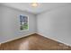Well-lit bedroom with a neutral color palette and hardwood flooring at 1025 Ridgefield Cir, Indian Trail, NC 28079