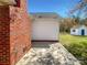 View of the exterior brick wall, siding, and a small shed in the backyard at 1025 Ridgefield Cir, Indian Trail, NC 28079
