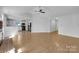 Open-concept living room featuring modern flooring and seamless flow into the bright, updated kitchen at 1025 Ridgefield Cir, Indian Trail, NC 28079