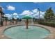 Community splash pad with a mushroom water feature surrounded by a fenced area for safety at 1027 Oleander Ln, Waxhaw, NC 28173