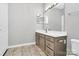 Well-lit bathroom featuring a modern vanity with a large mirror and neutral color scheme at 10663 Hill Point Ct, Charlotte, NC 28262