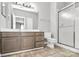 Bathroom features double vanity sinks, tiled floor, walk-in shower, and modern fixtures at 10663 Hill Point Ct, Charlotte, NC 28262