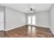 Bedroom with hardwood floors, ceiling fan, and a sliding glass door to the outside at 10663 Hill Point Ct, Charlotte, NC 28262