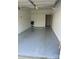Spacious garage with epoxy flooring and built in shelving at 10663 Hill Point Ct, Charlotte, NC 28262