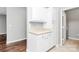 Bright kitchen featuring white cabinets, neutral countertops, and ample storage space at 10663 Hill Point Ct, Charlotte, NC 28262