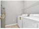 Laundry room features a washer, a dryer, and a utility water heater at 10663 Hill Point Ct, Charlotte, NC 28262