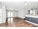 Inviting living space featuring ceiling fan, wood flooring, and access to backyard at 10663 Hill Point Ct, Charlotte, NC 28262