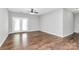 Spacious living area with hardwood floors and a glass door leading to a balcony at 10663 Hill Point Ct, Charlotte, NC 28262