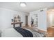 Bedroom featuring wood floors, a mirrored closet, and a console table with nature artwork at 107 Grand Canyon Rd, Stanley, NC 28164