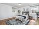 Relaxing bedroom with neutral tones, wood floors, a patterned rug, and natural light at 107 Grand Canyon Rd, Stanley, NC 28164