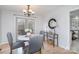 Bright dining room with hardwood floors, chandelier and doors leading to backyard deck at 107 Grand Canyon Rd, Stanley, NC 28164