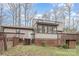 Exterior view of a two-story home featuring wood decks and a large screened-in porch at 107 Grand Canyon Rd, Stanley, NC 28164