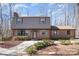 Charming brick home featuring manicured landscaping and a welcoming entrance at 107 Grand Canyon Rd, Stanley, NC 28164