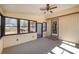 Inviting sunroom featuring a ceiling fan and providing access to the outdoors at 107 Grand Canyon Rd, Stanley, NC 28164