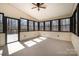 Bright sunroom with ample windows providing natural light and views of the surrounding nature at 107 Grand Canyon Rd, Stanley, NC 28164