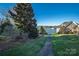 Backyard path leading to lake views showcasing lush greenery and waterfront proximity at 110 49Th Avenue Nw Pl, Hickory, NC 28601