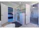 Open bathroom featuring glass shower, with a view into an adjacent bedroom at 110 49Th Avenue Nw Pl, Hickory, NC 28601