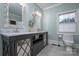 Stylish bathroom with double vanities, decorative mirrors, and a modern lighting fixture at 110 49Th Avenue Nw Pl, Hickory, NC 28601
