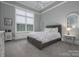 Serene bedroom with neutral tones, large windows, and a cozy seating area at 110 49Th Avenue Nw Pl, Hickory, NC 28601