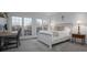 Bright bedroom with a work area, white furniture, and natural light from large windows at 110 49Th Avenue Nw Pl, Hickory, NC 28601