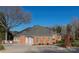 Brick home featuring an attached two-car garage, manicured lawn, and landscaped yard at 110 49Th Avenue Nw Pl, Hickory, NC 28601