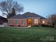 Charming brick home featuring a well-manicured lawn, mature landscaping, and a welcoming front entrance at 110 49Th Avenue Nw Pl, Hickory, NC 28601