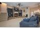 Cozy living room with a stone fireplace, built-in bookshelves, and comfortable seating at 110 49Th Avenue Nw Pl, Hickory, NC 28601