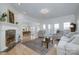 Bright living room with fireplace and views, seamlessly connects to dining area, ideal for Gathering gatherings at 110 49Th Avenue Nw Pl, Hickory, NC 28601