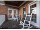 Relaxing covered porch featuring comfortable rocking chairs, ideal for enjoying peaceful outdoor moments at 110 49Th Avenue Nw Pl, Hickory, NC 28601