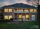 Spacious home with a large balcony, manicured lawn, outdoor patio, and serene backyard setting at 110 49Th Avenue Nw Pl, Hickory, NC 28601