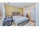 Comfortable bedroom featuring a queen-sized bed, soft lighting, and ensuite bathroom for convenience and privacy at 1108 Stella Ct, Monroe, NC 28110