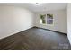 Bright bedroom with a large window and neutral walls and carpet at 1144 Amberlight Cir, Salisbury, NC 28144
