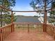 View from a wooden deck overlooking the backyard and surrounding trees at 1144 Amberlight Cir, Salisbury, NC 28144