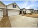 Charming single-Gathering home with a spacious driveway and attached two-car garage at 1144 Amberlight Cir, Salisbury, NC 28144