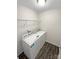 Convenient laundry room with washer and dryer hookups, as well as wire shelving at 1144 Amberlight Cir, Salisbury, NC 28144