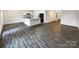 Bright living room featuring open floor plan with an island and modern flooring at 1144 Amberlight Cir, Salisbury, NC 28144