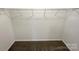 Spacious walk-in closet featuring ample shelving and neutral carpeting for organized storage at 1144 Amberlight Cir, Salisbury, NC 28144