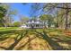A large manicured lawn leads up to the two-story home with a classic front porch at 121 N Congress St, York, SC 29745