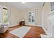 Bright bedroom with large windows, hardwood floors, and a fireplace at 121 N Congress St, York, SC 29745