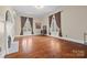 Spacious bedroom features hardwood floors, neutral walls, and bright natural light at 121 N Congress St, York, SC 29745